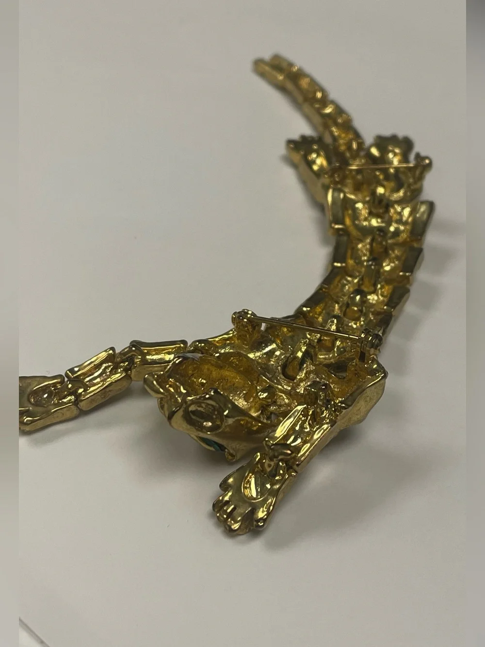 Vintage Articulated Gold-tone Prowling Panther Brooch with Green Eyes